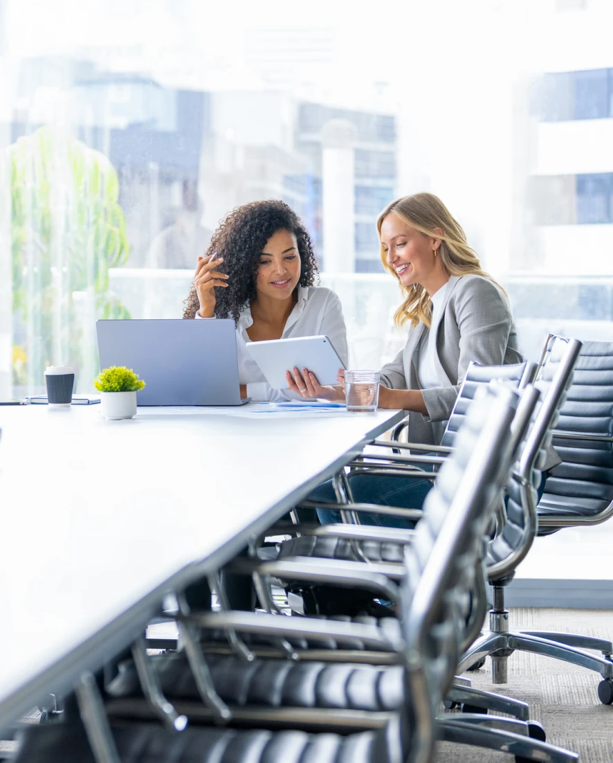 Professional women collaborating in modern office.