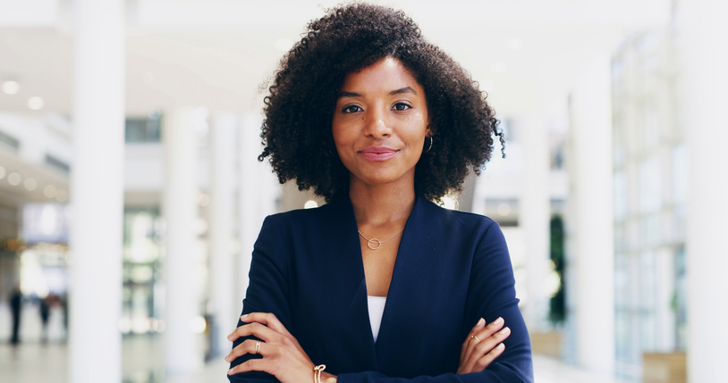 Portrait, lawyer or black woman in office with arms crossed for advocate, confidence or practice. Proud, legal counsel or attorney clerk at law firm for career growth, litigation or justice